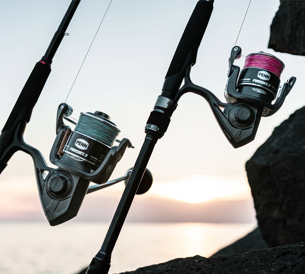 Fishing rods with Penn fishing reels against a blurred natural background