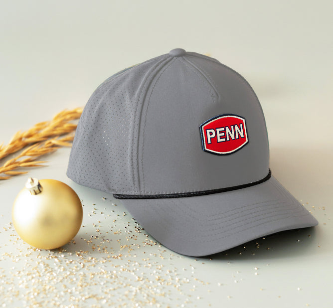 Penn grey hat next to Christmas ornament