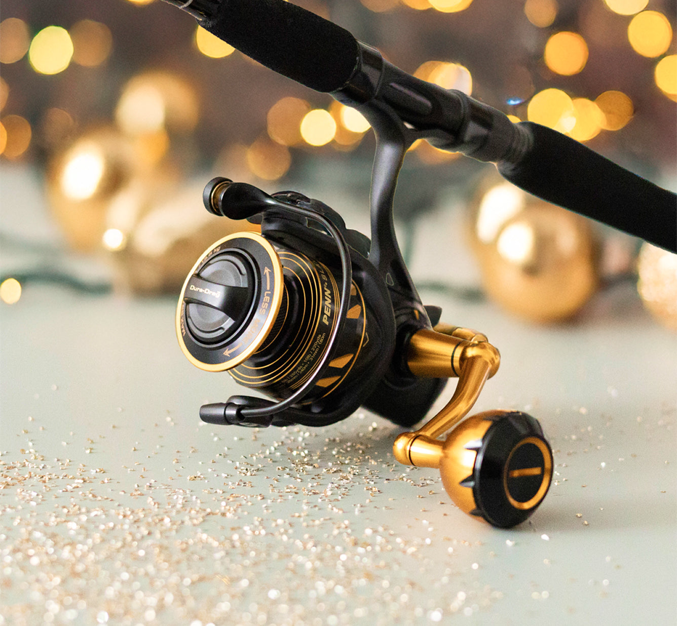 Slammer Reel and Carnage Rod in front of holiday lights