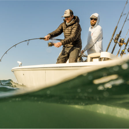 2 men fishing on a boat